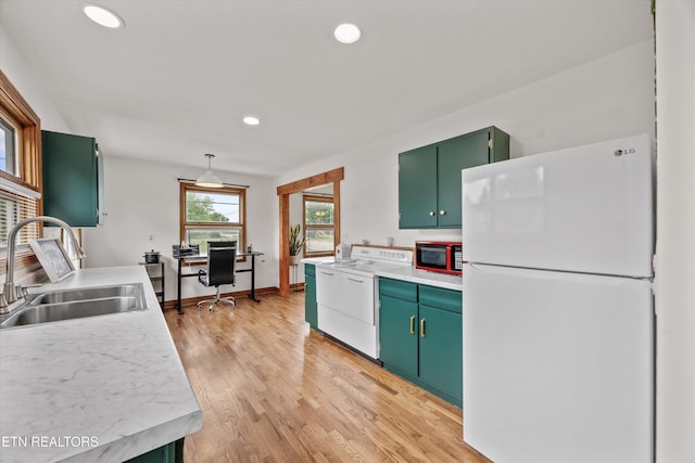 2931 E Emory Rd, Knoxville, TN 37938 - kitchen with white appliances, light countertops, green cabinets, recessed lighting, and light wood-style floors