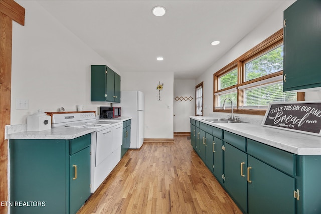 2931 E Emory Rd, Knoxville, TN 37938 - kitchen featuring white appliances, light wood-style floors, light countertops, recessed lighting, and green cabinetry