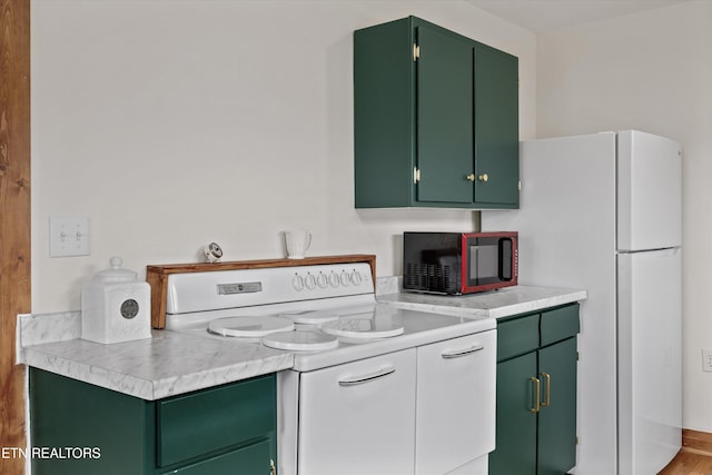 2931 E Emory Rd, Knoxville, TN 37938 - kitchen featuring electric stove, green cabinets, and light countertops