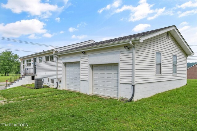 2931 E Emory Rd, Knoxville, TN 37938 - view of home's exterior featuring a yard, a garage, and driveway