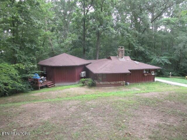 262 Mountain View Dr, Rutledge, TN 37861 - view of side of home with a chimney and a view of trees