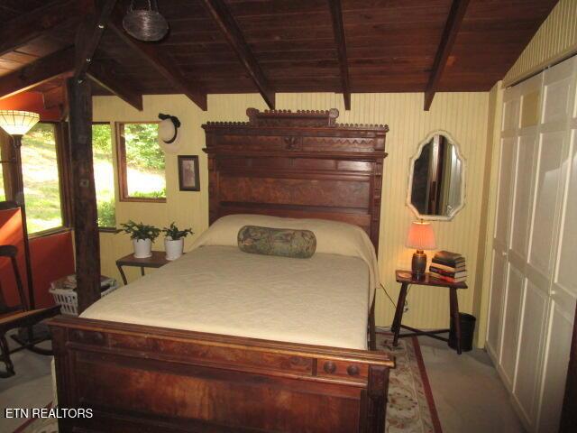 262 Mountain View Dr, Rutledge, TN 37861 - carpeted bedroom with wooden ceiling