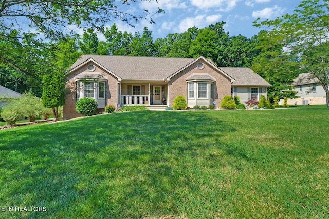 151 Northridge Dr, Fairfield Glade, TN 38558 - ranch-style home featuring brick siding, a porch, and a front yard