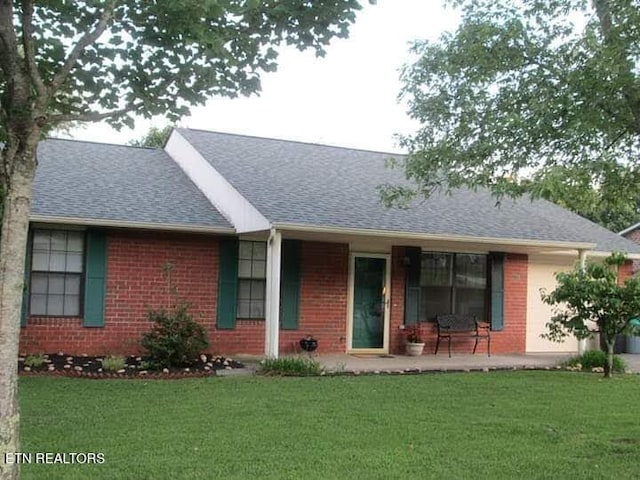 11336 Wrens Nest Ln, Knoxville, TN 37932 - rear view of property with a lawn, brick siding, and a shingled roof