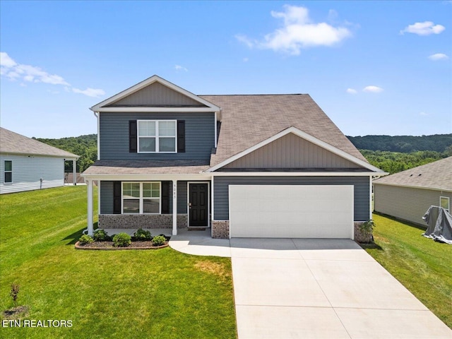5083 Elm Brook Rd, Dandridge, TN 37725 - craftsman inspired home with a garage, a front lawn, driveway, covered porch, and roof with shingles