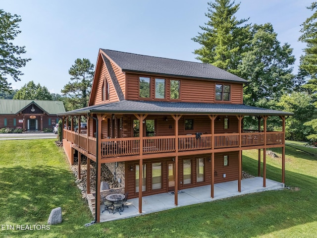 2028 Piney Overlook Ln, Sevierville, TN 37862 - back of house with faux log siding, a lawn, a patio, and a wooden deck