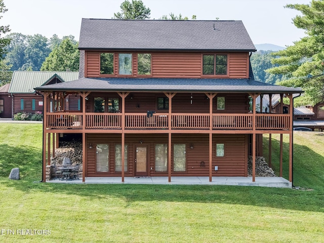 2028 Piney Overlook Ln, Sevierville, TN 37862 - back of house featuring roof with shingles, a patio area, and a lawn