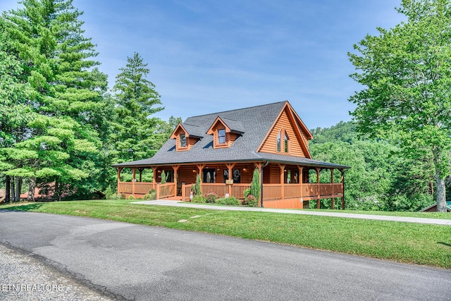 2028 Piney Overlook Ln, Sevierville, TN 37862 - log cabin with covered porch, a front yard, and roof with shingles