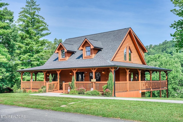 2028 Piney Overlook Ln, Sevierville, TN 37862 - view of front of home with a porch, a front yard, and a shingled roof