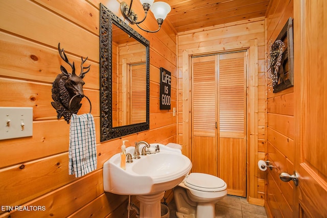 2028 Piney Overlook Ln, Sevierville, TN 37862 - bathroom with wood walls, wood ceiling, and tile patterned floors