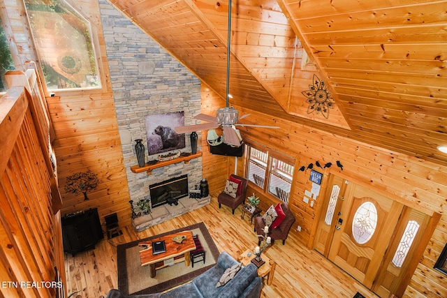 2028 Piney Overlook Ln, Sevierville, TN 37862 - living room with wooden ceiling, light wood-style floors, plenty of natural light, a ceiling fan, and wood walls