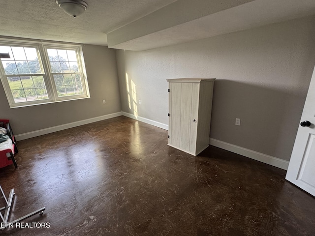 115 Red Oak Ln, New Tazewell, TN 37825 - unfurnished bedroom with baseboards and a textured ceiling