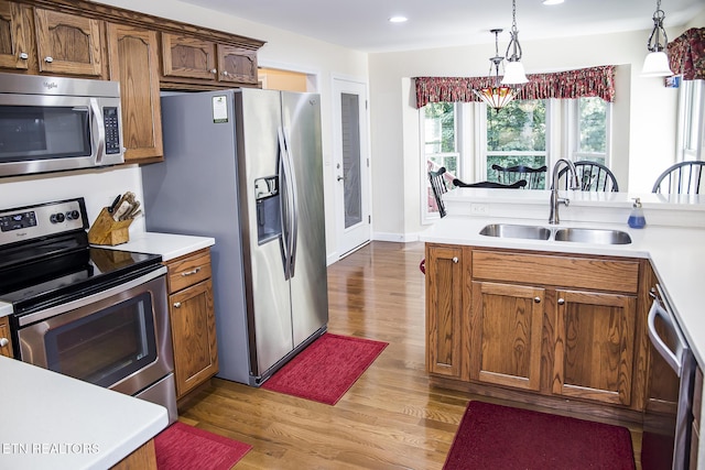 520 Wimberly Rd, Crossville, TN 38558 - kitchen with appliances with stainless steel finishes, light countertops, wood finished floors, decorative light fixtures, and recessed lighting