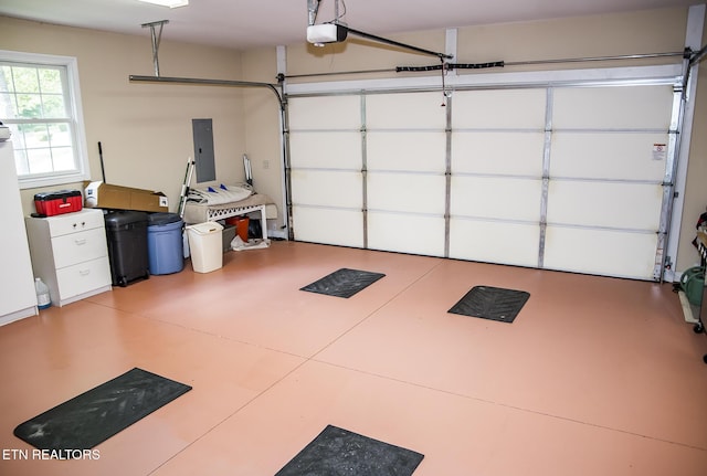 520 Wimberly Rd, Crossville, TN 38558 - garage featuring a garage door opener and electric panel