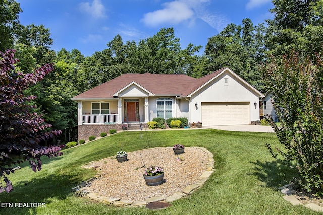 520 Wimberly Rd, Crossville, TN 38558 - single story home with an attached garage, a porch, a front yard, concrete driveway, and stucco siding