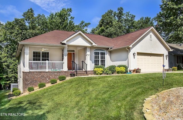 520 Wimberly Rd, Crossville, TN 38558 - ranch-style house with a front lawn, covered porch, a garage, and driveway