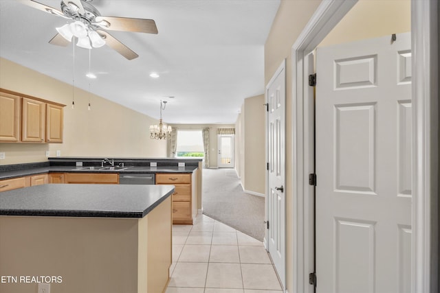 427 Cimarron Cir, Loudon, TN 37774 - kitchen with light brown cabinetry, dark countertops, a peninsula, a ceiling fan, and stainless steel dishwasher