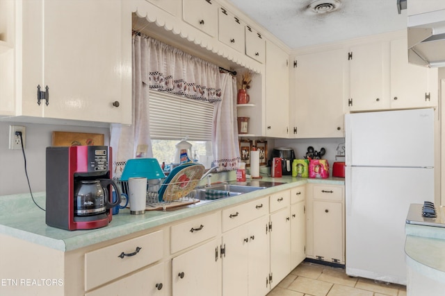 1175 Cardnal Cv, Rutledge, TN 37861 - kitchen featuring freestanding refrigerator, light countertops, and light tile patterned floors