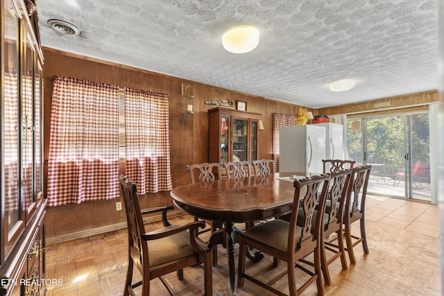 1175 Cardnal Cv, Rutledge, TN 37861 - dining room with a textured ceiling and wood walls
