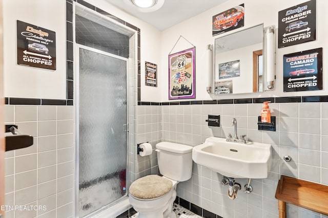 1175 Cardnal Cv, Rutledge, TN 37861 - full bath with tile walls, a stall shower, wainscoting, and tile patterned flooring