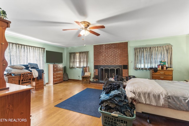 1175 Cardnal Cv, Rutledge, TN 37861 - bedroom with a fireplace, wood finished floors, and ceiling fan