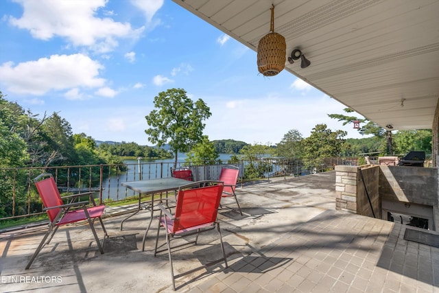 1175 Cardnal Cv, Rutledge, TN 37861 - view of patio featuring area for grilling, a water view, and outdoor dining area