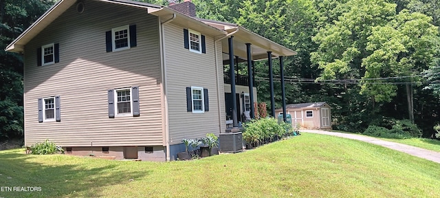 5412 E Lamar Alex Pkwy, Walland, TN 37886 - view of side of property with a shed, a chimney, a lawn, and crawl space