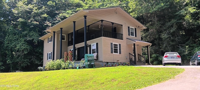 5412 E Lamar Alex Pkwy, Walland, TN 37886 - view of front facade featuring a front yard, ceiling fan, and a balcony