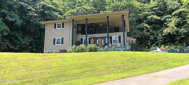 5412 E Lamar Alex Pkwy, Walland, TN 37886 - view of front of home with a front lawn, a balcony, and a chimney