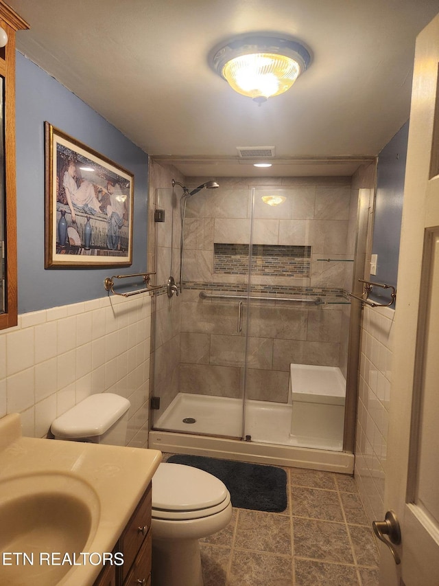 5412 E Lamar Alex Pkwy, Walland, TN 37886 - full bath featuring tile walls, vanity, a shower stall, and tile patterned flooring