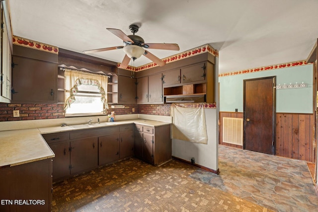 245 County Road 775, Riceville, TN 37370 - kitchen with open shelves, ceiling fan, wainscoting, light countertops, and wooden walls