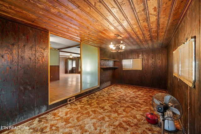 245 County Road 775, Riceville, TN 37370 - carpeted empty room with wooden walls, wooden ceiling, and a chandelier