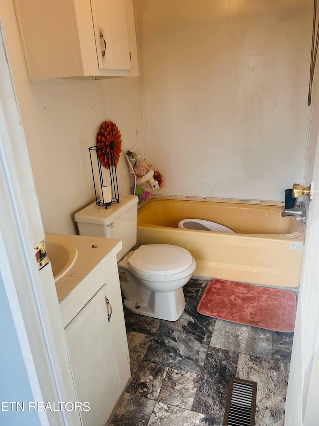 181 Claude Hargis Ln, Crawford, TN 38554 - bathroom with vanity, a bathtub, and stone finish flooring
