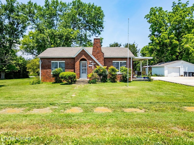 313 Locust St, Englewood, TN 37329 - view of front of property with a detached garage, an outbuilding, a chimney, a front lawn, and brick siding