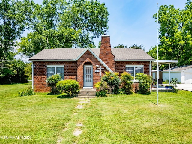 313 Locust St, Englewood, TN 37329 - view of front of property featuring a chimney, brick siding, a front yard, and roof with shingles