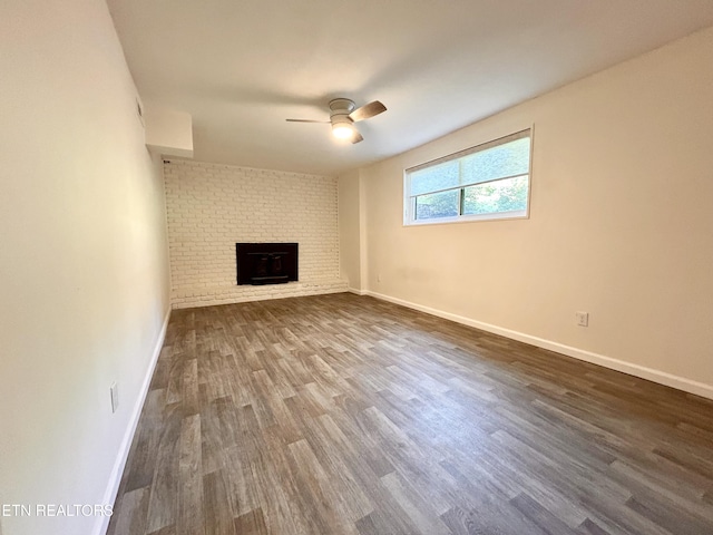 233 Chaho Rd Unit 3, Knoxville, TN 37934 - unfurnished living room featuring a ceiling fan, dark wood finished floors, and a fireplace