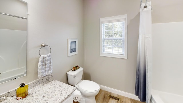 101 Maca Ridge Cir, Clarkrange, TN 38553 - full bathroom featuring wood finished floors, vanity, and shower / tub combo