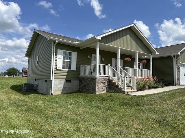 101 Maca Ridge Cir, Clarkrange, TN 38553 - view of front facade with crawl space, a porch, a front yard, and an attached garage