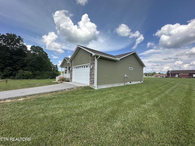 101 Maca Ridge Cir, Clarkrange, TN 38553 - view of home's exterior with an attached garage, driveway, a yard, and stone siding