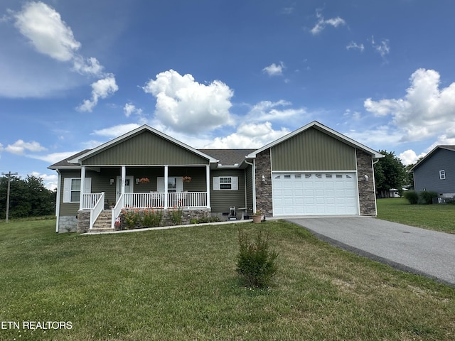 101 Maca Ridge Cir, Clarkrange, TN 38553 - view of front of property featuring a porch, driveway, a garage, a front yard, and stone siding