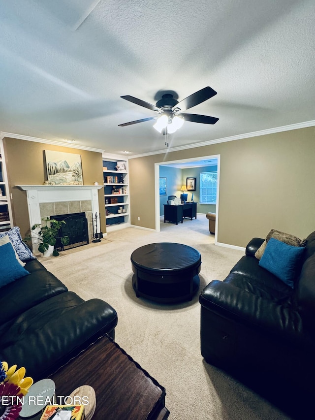 13001 Sanderling Ln, Knoxville, TN 37922 - carpeted living area featuring a textured ceiling, a ceiling fan, a fireplace, built in shelves, and ornamental molding