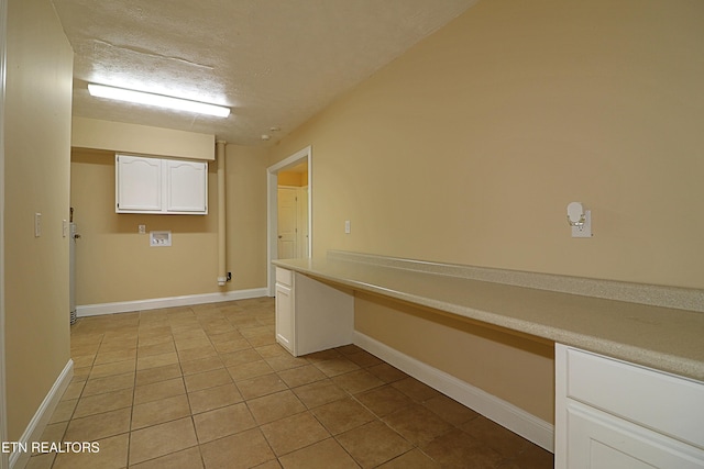 22453 Alberta St, Oneida, TN 37841 - laundry area featuring light tile patterned flooring, hookup for a washing machine, and a textured ceiling