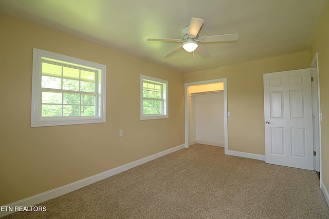 22453 Alberta St, Oneida, TN 37841 - unfurnished bedroom featuring light carpet, a closet, and ceiling fan
