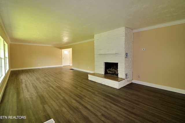 22453 Alberta St, Oneida, TN 37841 - unfurnished living room featuring dark wood-style flooring, ornamental molding, and a fireplace
