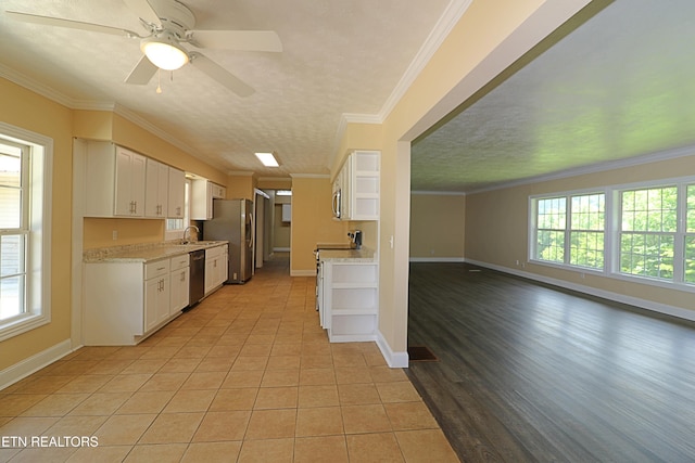 22453 Alberta St, Oneida, TN 37841 - kitchen with stainless steel appliances, open shelves, plenty of natural light, ornamental molding, and white cabinetry