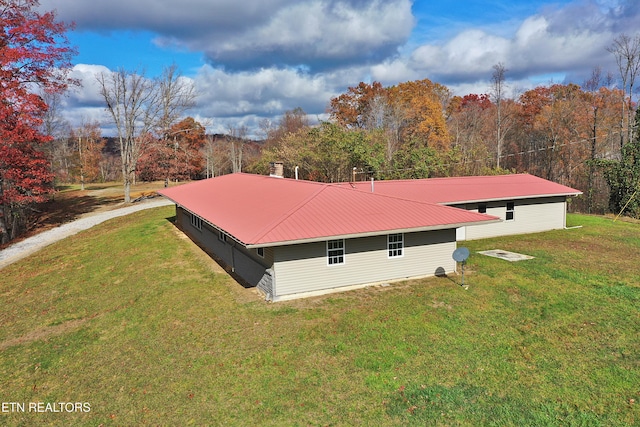 22453 Alberta St, Oneida, TN 37841 - view of property exterior featuring a lawn and a metal roof