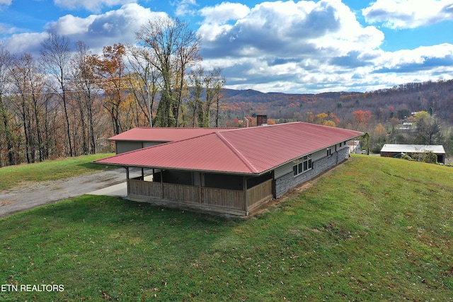 22453 Alberta St, Oneida, TN 37841 - view of side of home featuring a metal roof, a lawn, a mountain view, driveway, and a chimney