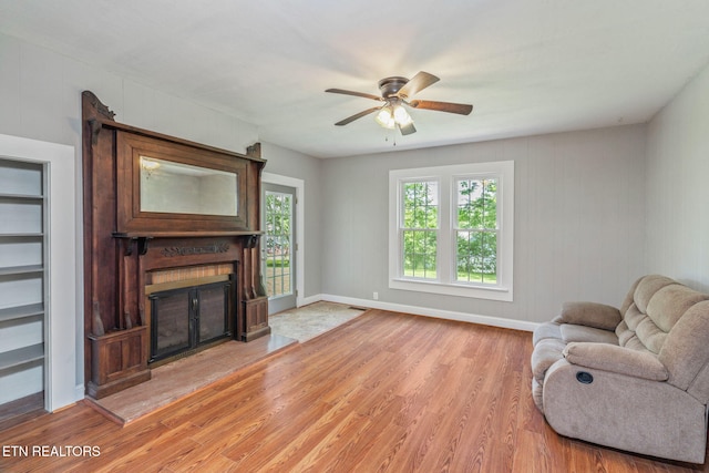 2115 Aaron Ct, Sevierville, TN 37876 - living room featuring light wood-style floors, a large fireplace, and ceiling fan