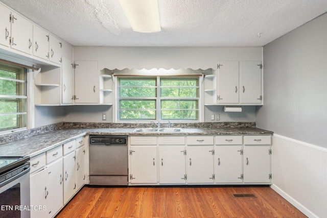 2115 Aaron Ct, Sevierville, TN 37876 - kitchen featuring open shelves, dishwashing machine, light wood-style floors, white cabinets, and a textured ceiling