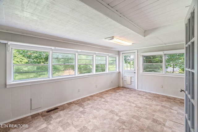 2115 Aaron Ct, Sevierville, TN 37876 - unfurnished sunroom featuring plenty of natural light, wooden walls, and tile patterned floors